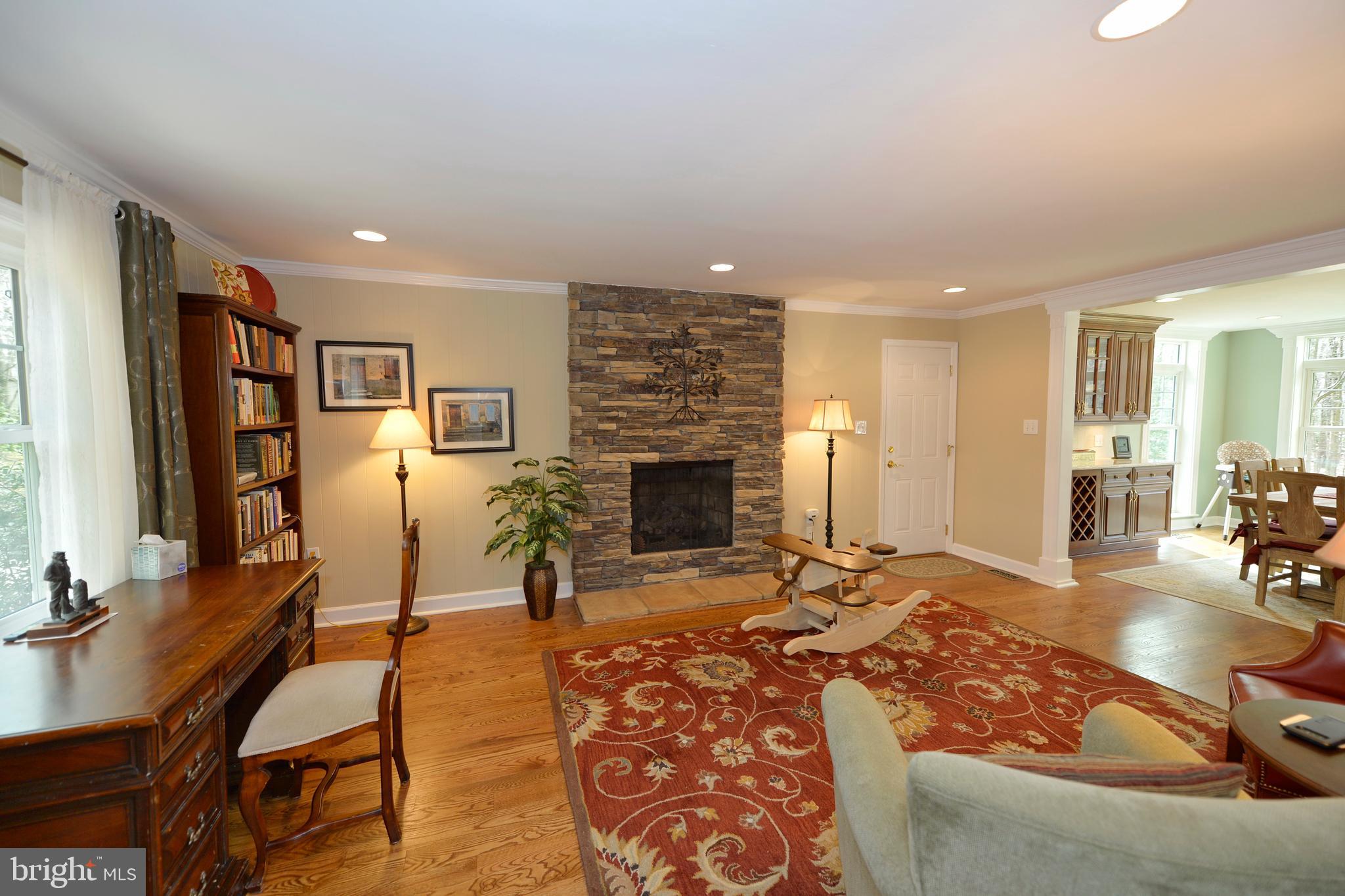 11403 Running Cedar Road Reston, VA 20191 - Photo 14 of 58 Formal living room with stacked stone fireplace.