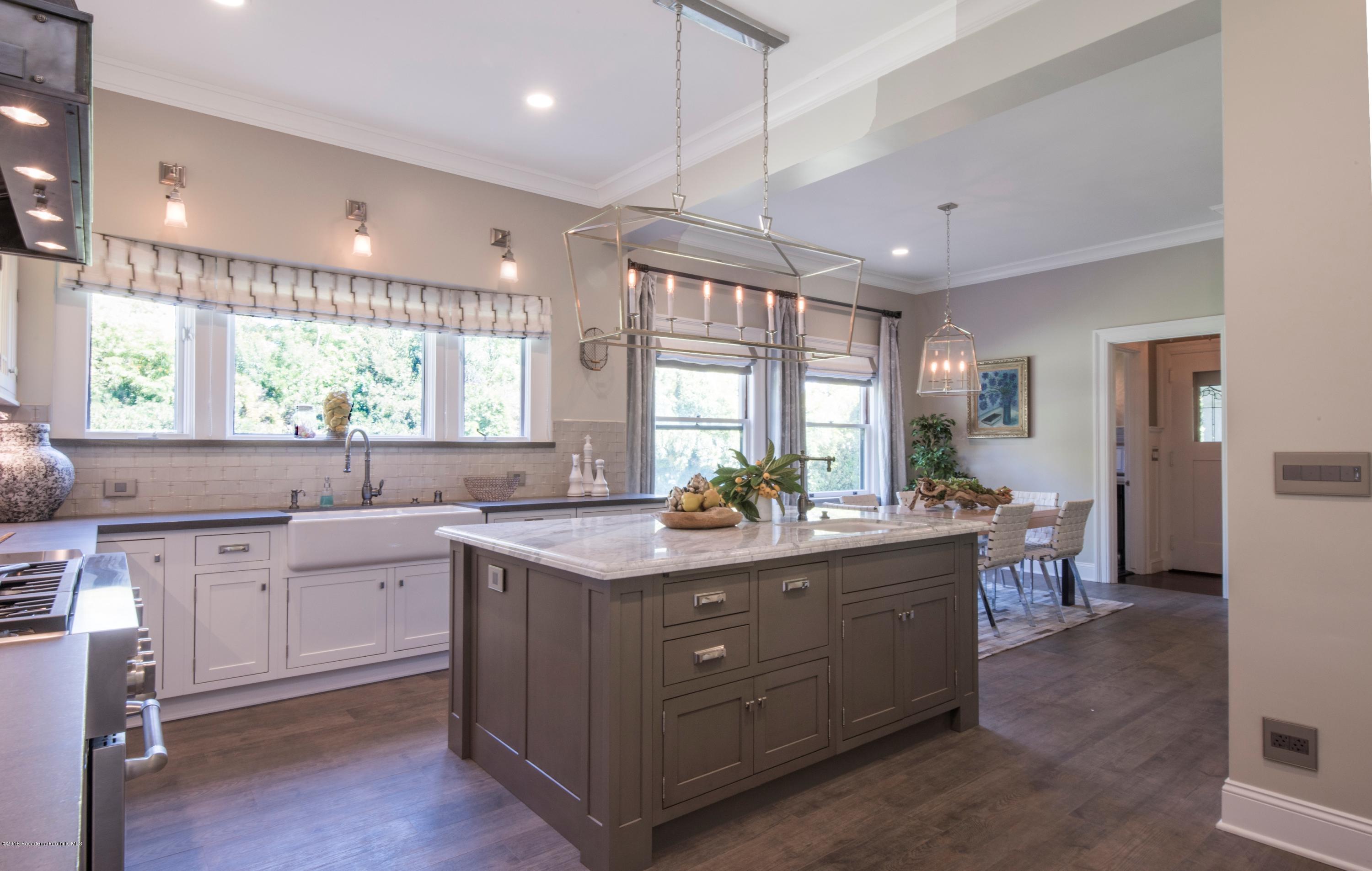 1333 Wentworth Avenue Pasadena, CA 91106 - Photo 16 of 60 a kitchen with lots of counter top space sink and refrigerator