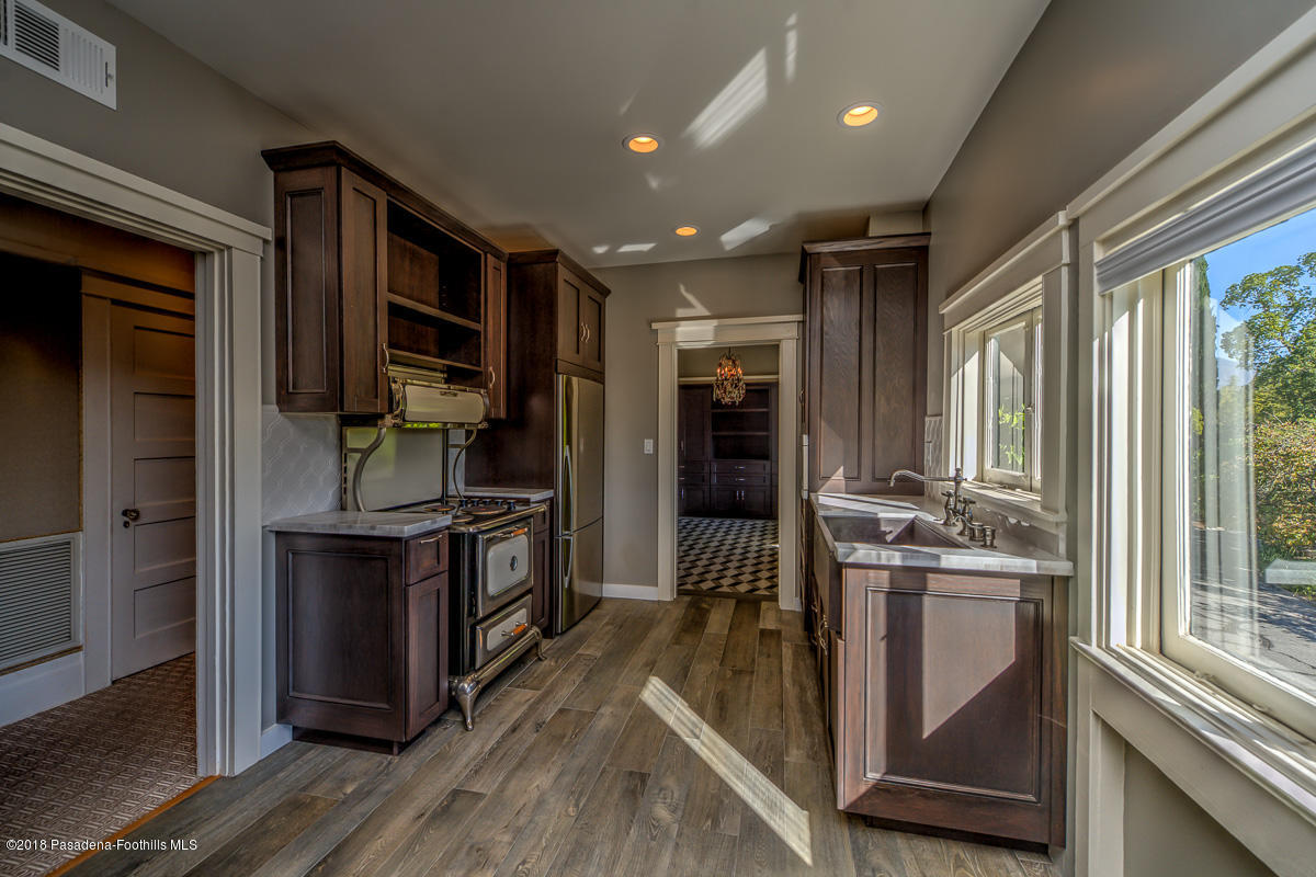 1333 Wentworth Avenue Pasadena, CA 91106 - Photo 38 of 60 a kitchen with stainless steel appliances granite countertop a stove and a refrigerator