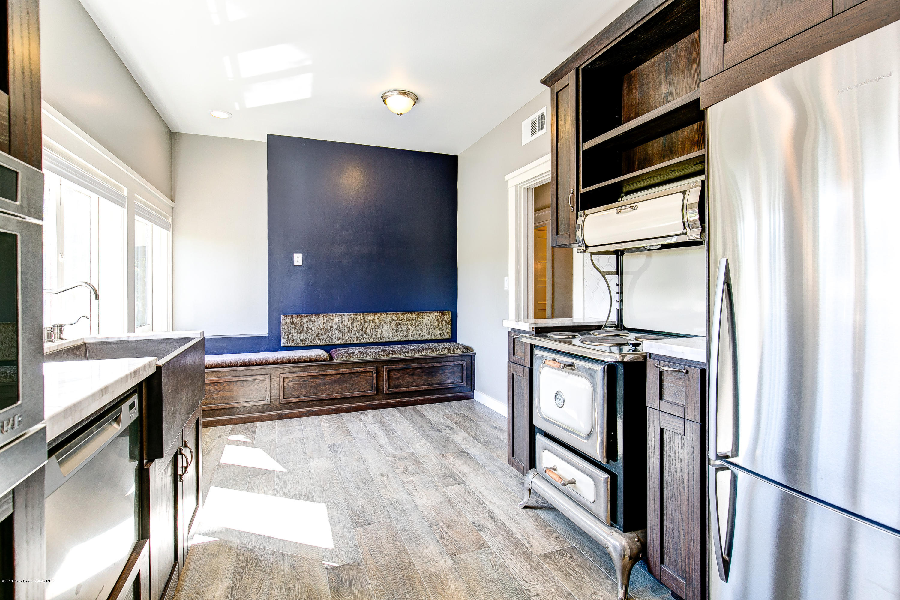 1333 Wentworth Avenue Pasadena, CA 91106 - Photo 39 of 60 a kitchen with stainless steel appliances granite countertop a stove a sink and a refrigerator