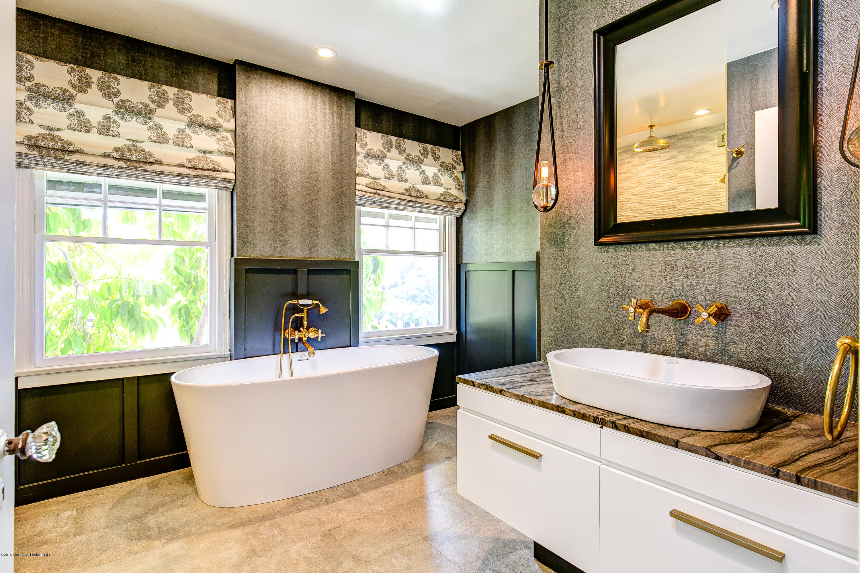 1333 Wentworth Avenue Pasadena, CA 91106 - Photo 43 of 60 a bathroom with a granite countertop sink and a large mirror
