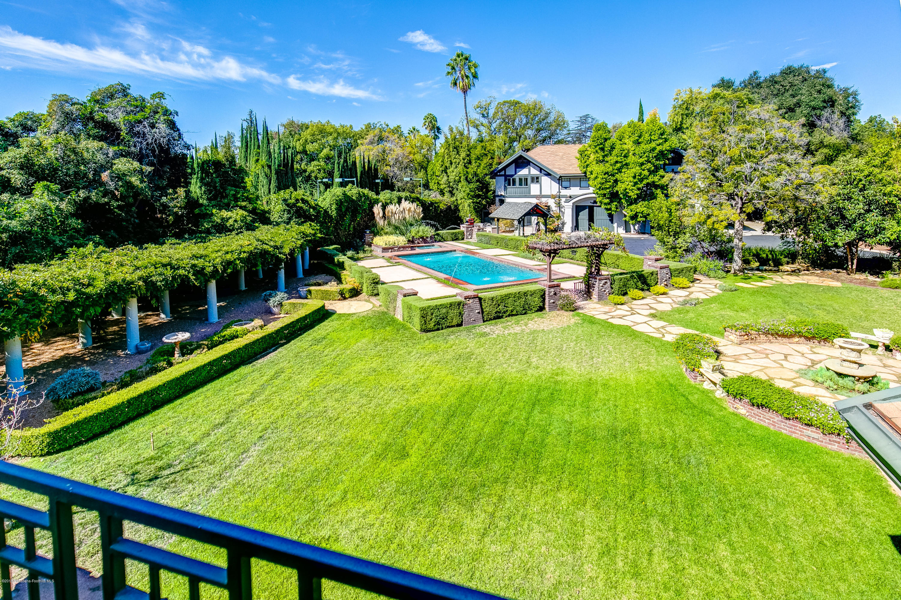 1333 Wentworth Avenue Pasadena, CA 91106 - Photo 52 of 60 a view of a swimming pool with a garden and seating area