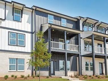 6030 Molo Lane Cumming, GA 30041 - Photo 1 of 3 a front view of a residential apartment building with a yard