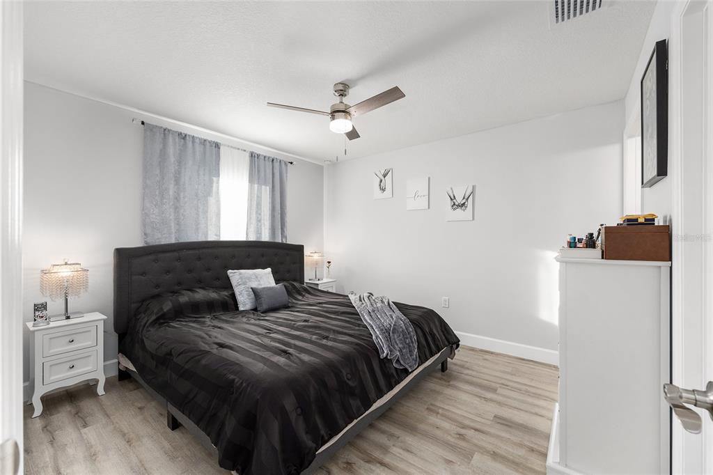 3597 Southwest 151st Avenue Ocala, FL 34481 - Photo 17 of 35 a bedroom with a bed and a dresser
