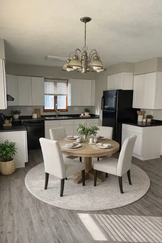 a kitchen with a table and chairs in it