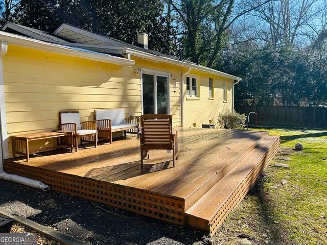 a view of backyard with swimming pool