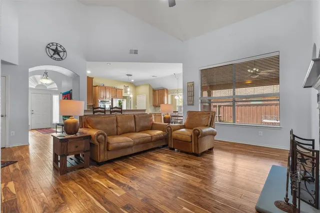 a living room with furniture window and wooden floor