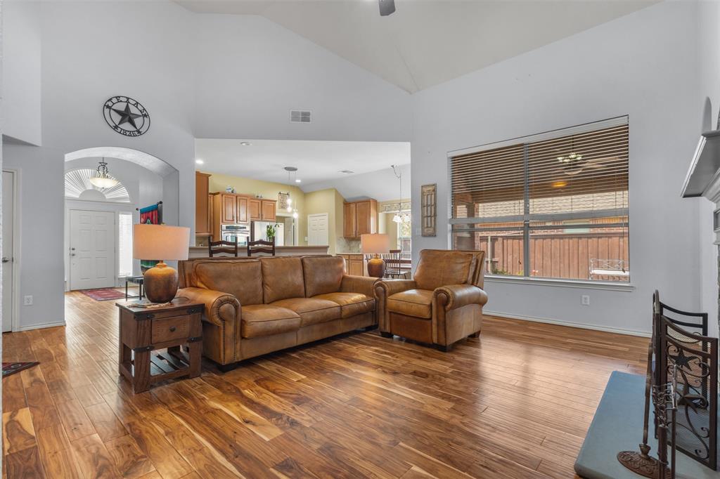 12334 Blue Ridge Drive Frisco, TX 75033 - Photo 15 of 32 a living room with furniture window and wooden floor