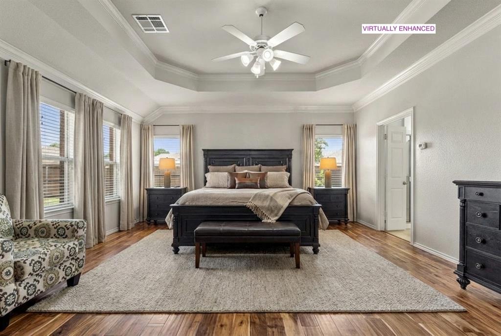 12334 Blue Ridge Drive Frisco, TX 75033 - Photo 2 of 32 a bedroom with a bed and a chandelier