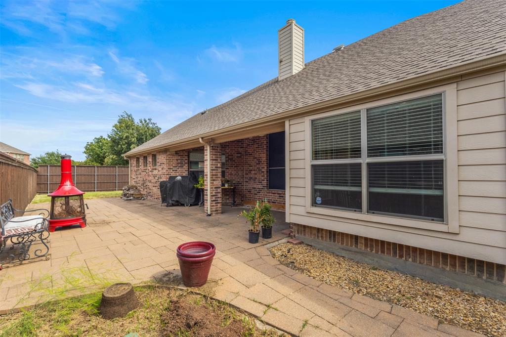12334 Blue Ridge Drive Frisco, TX 75033 - Photo 25 of 32 a stairs and bench in front of a house