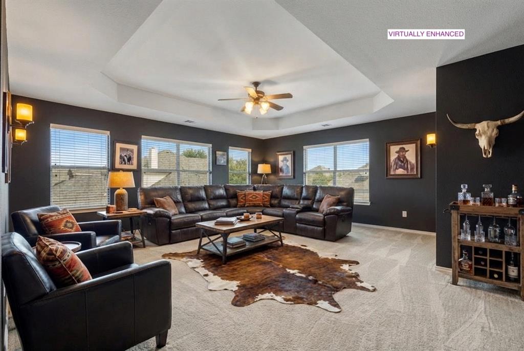 12334 Blue Ridge Drive Frisco, TX 75033 - Photo 4 of 32 a living room with furniture and a flat screen tv