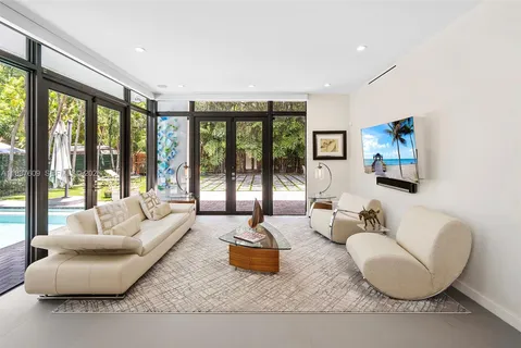 a large bedroom with a large bed and a large window