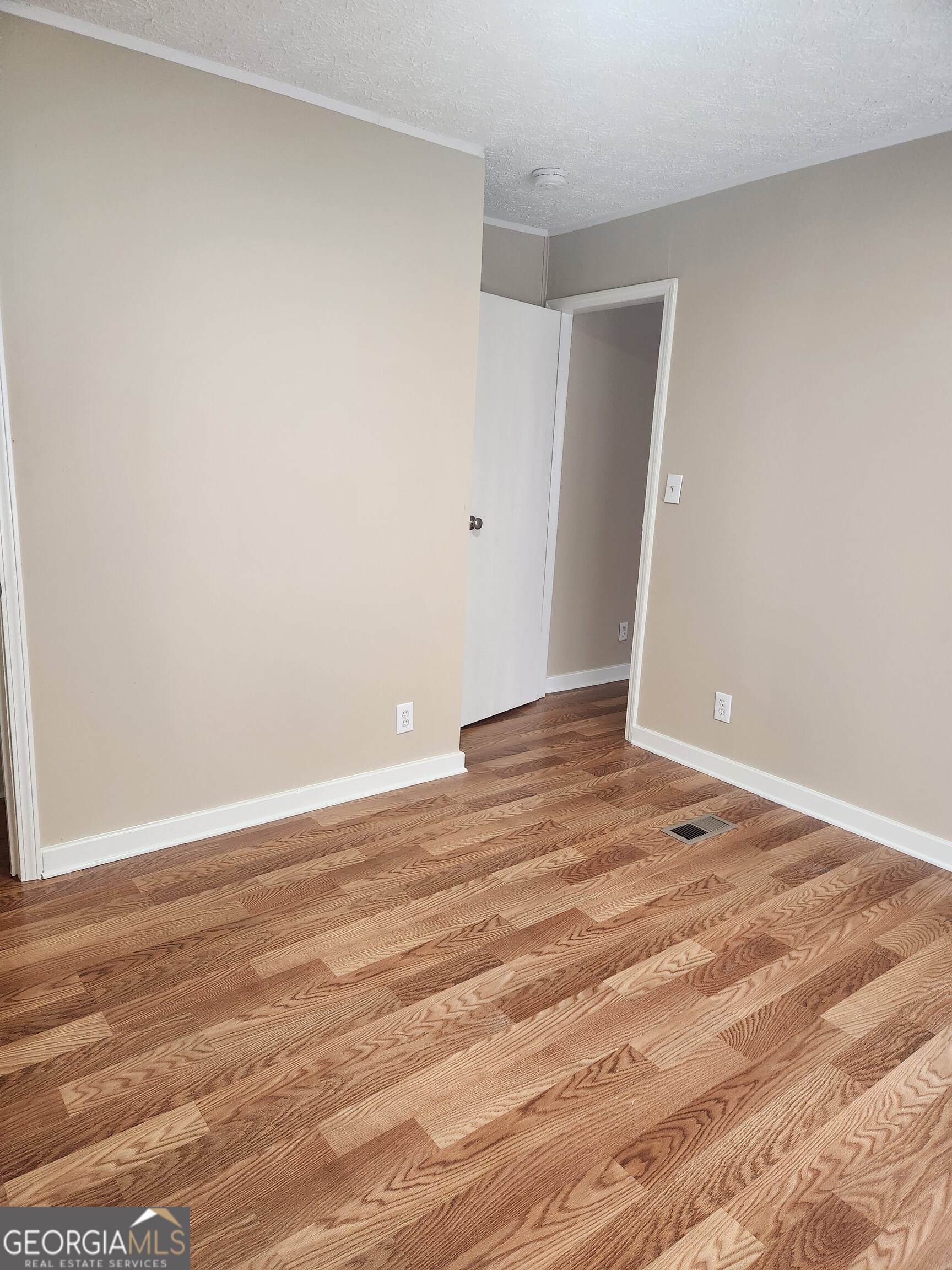 88 Dry Creek Road Danielsville, GA 30633 - Photo 11 of 20 a view of empty room with wooden floor