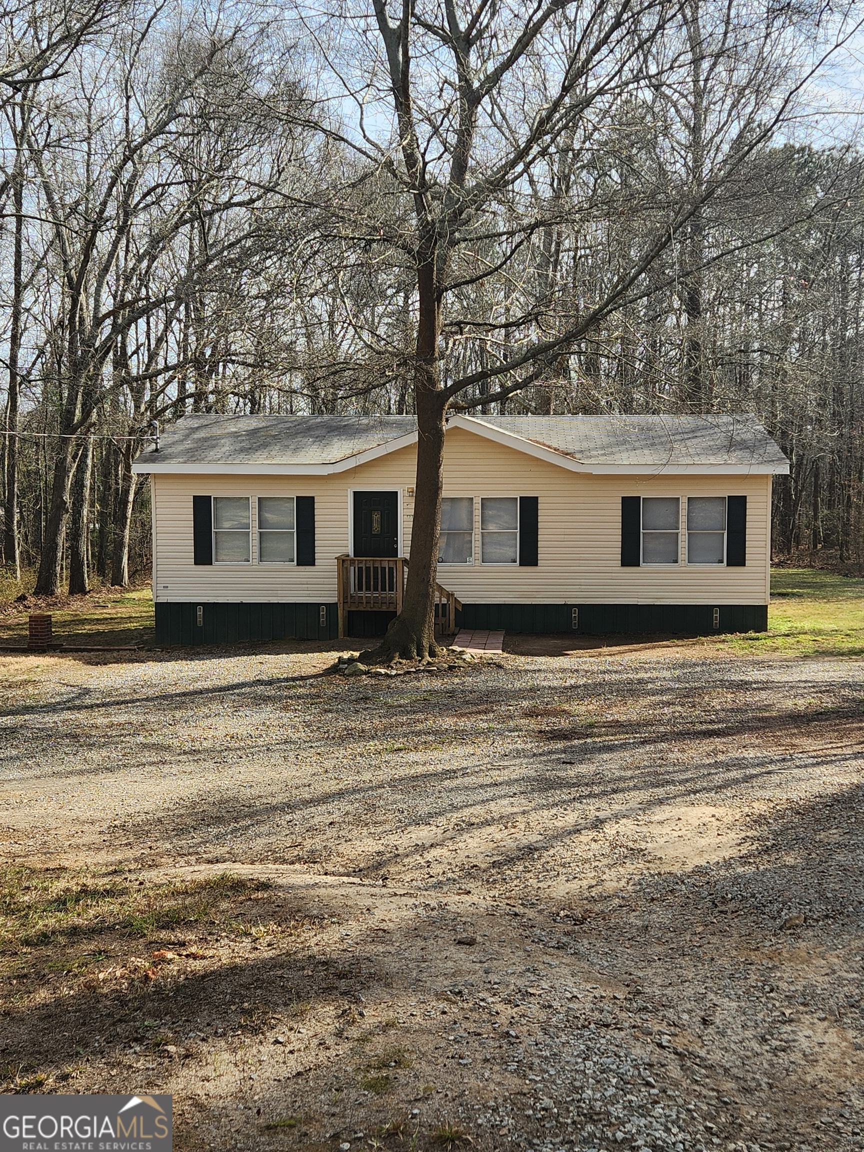 88 Dry Creek Road Danielsville, GA 30633 - Photo 2 of 20 a front view of a house with a boat