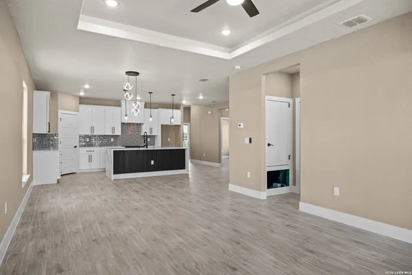a large kitchen with stainless steel appliances kitchen island a large counter top and a sink