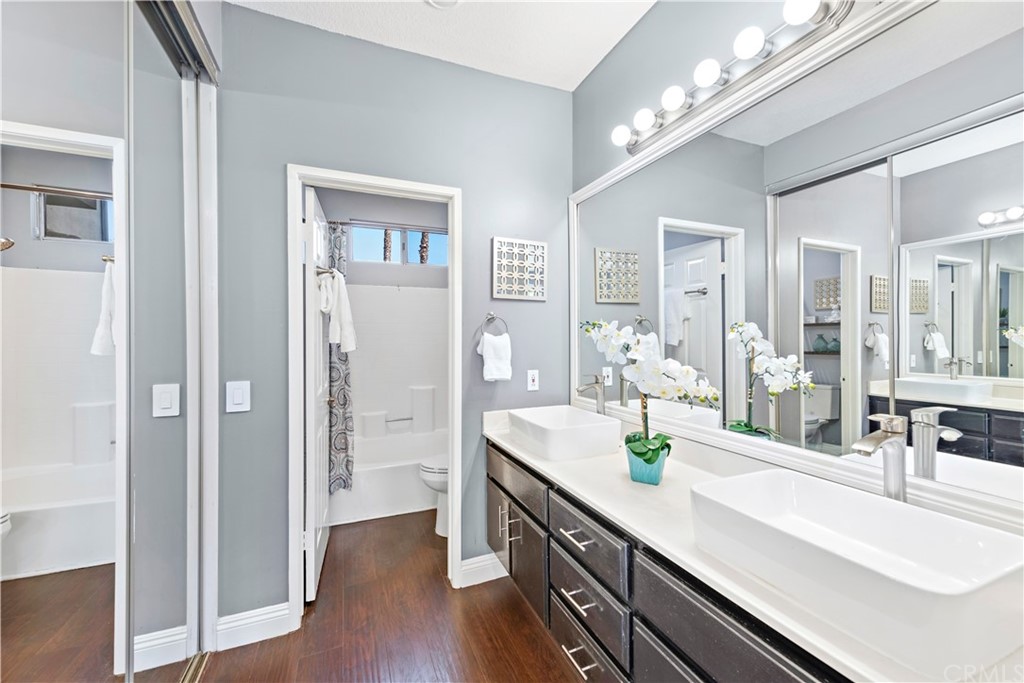 2 Vía Entrada Rancho Santa Margarita, CA 92688 - Photo 17 of 35 a bathroom with a double vanity sink and a mirror