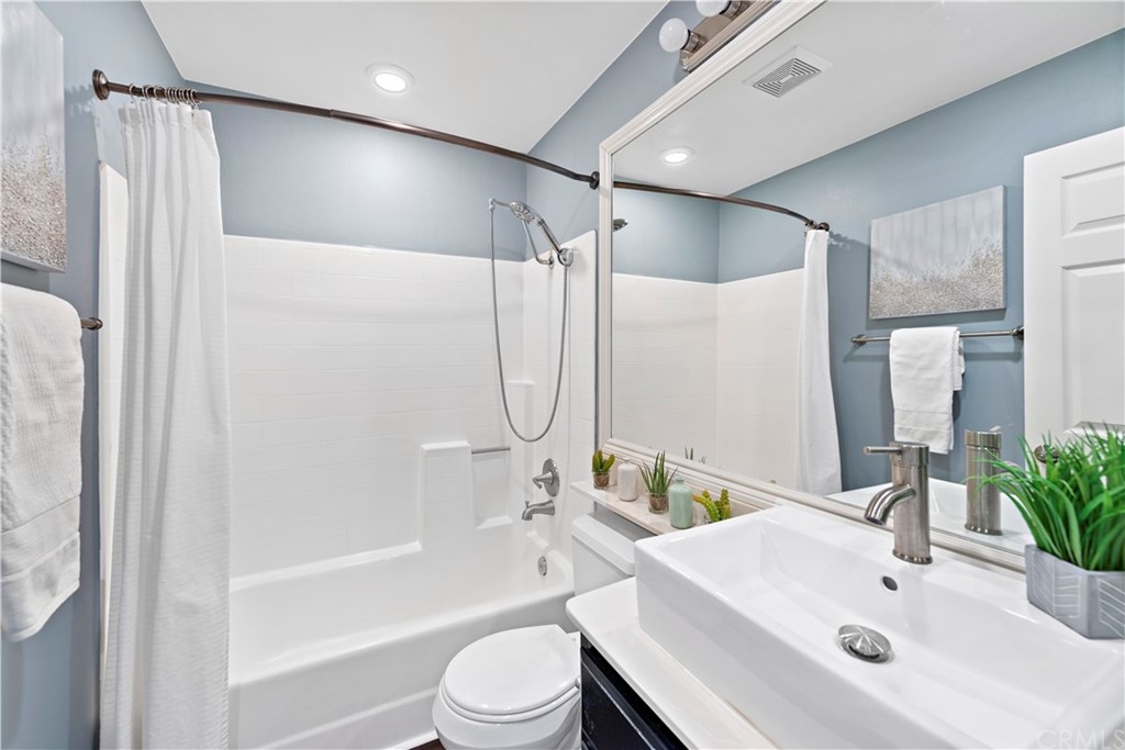 2 Vía Entrada Rancho Santa Margarita, CA 92688 - Photo 19 of 35 a bathroom with a sink toilet and shower