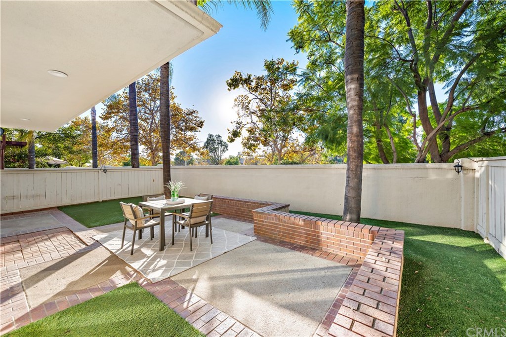 2 Vía Entrada Rancho Santa Margarita, CA 92688 - Photo 24 of 35 a view of a patio with table and chairs and potted plants