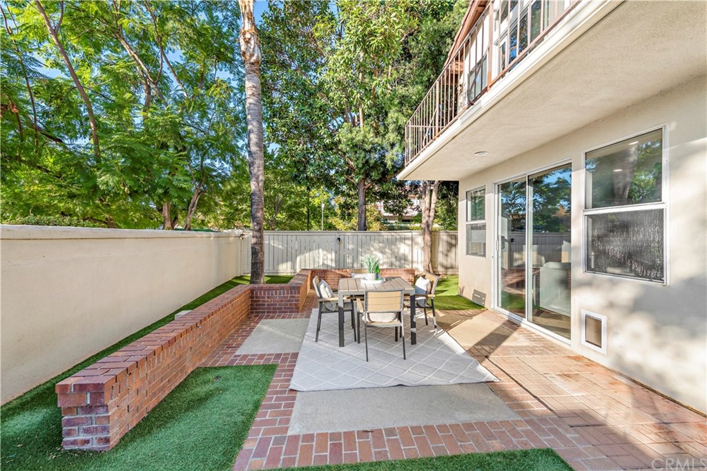 2 Vía Entrada Rancho Santa Margarita, CA 92688 - Photo 28 of 35 a view of a patio with table and chairs and potted plants