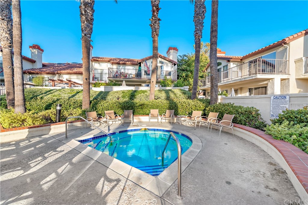 2 Vía Entrada Rancho Santa Margarita, CA 92688 - Photo 35 of 35 a view of a swimming pool with a lounge chairs