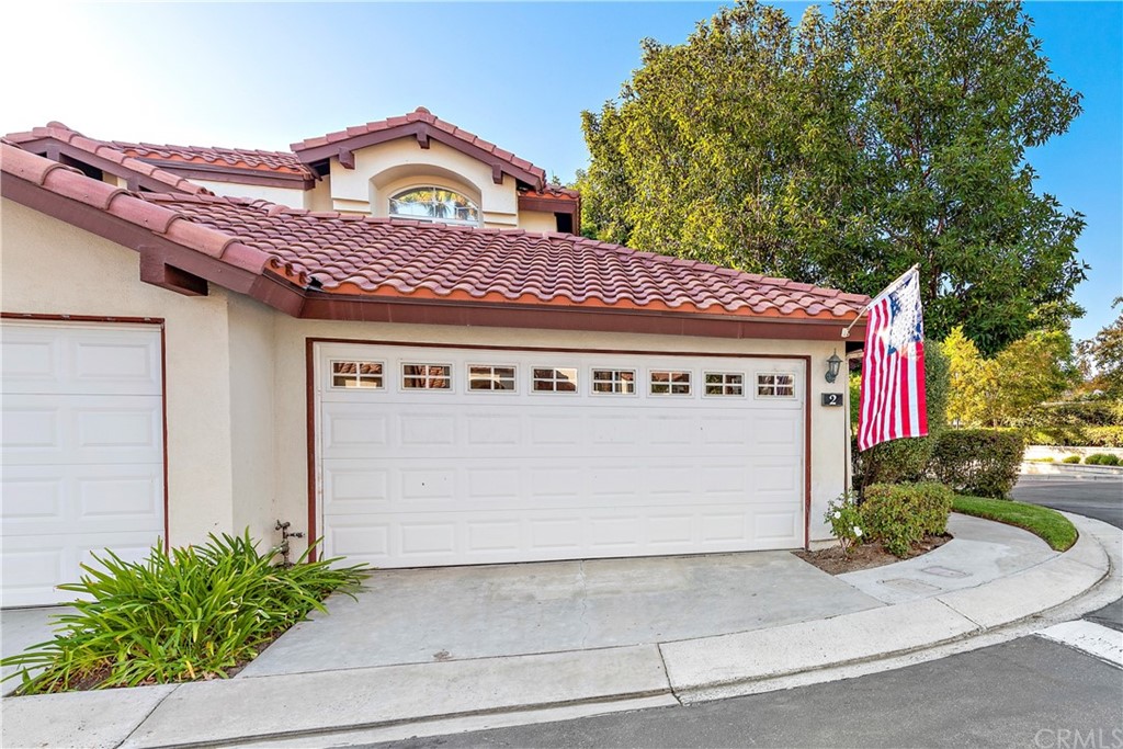 2 Vía Entrada Rancho Santa Margarita, CA 92688 - Photo 6 of 35 a front view of a building with garden