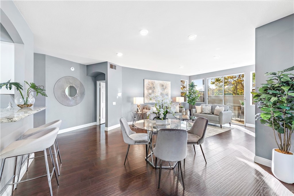 2 Vía Entrada Rancho Santa Margarita, CA 92688 - Photo 8 of 35 a dining room with furniture potted plants and wooden floor