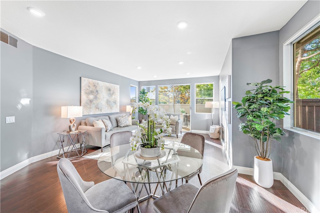 2 Vía Entrada Rancho Santa Margarita, CA 92688 - Photo 10 of 35 a living room with furniture potted plant and a large window