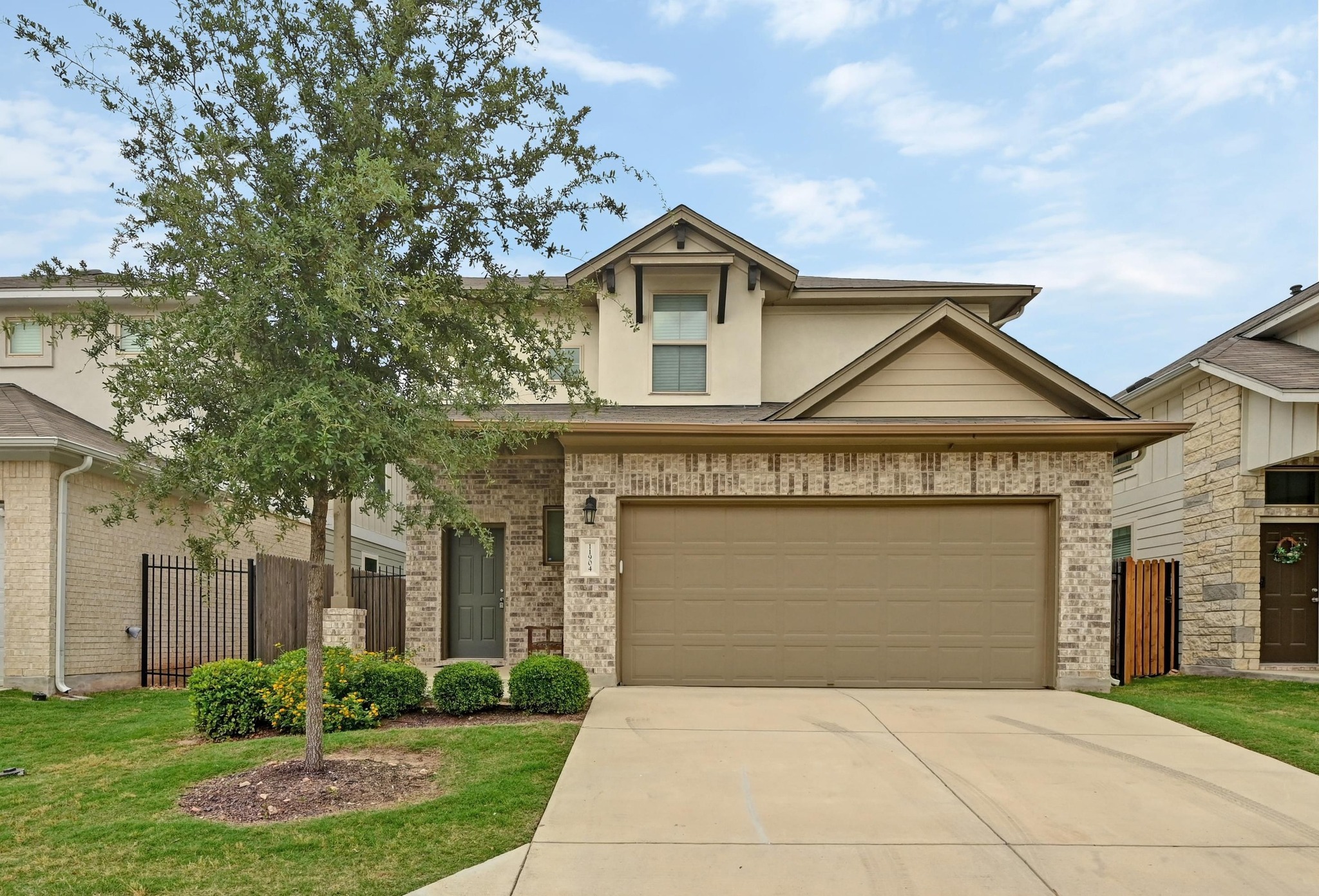 a front view of a house with garden