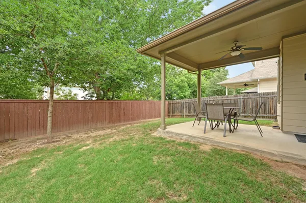 a view of a chairs and table in the patio
