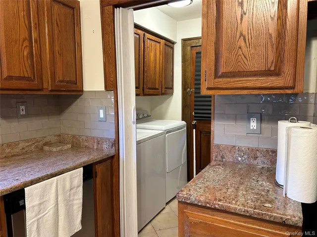 a living room with furniture and a lamp