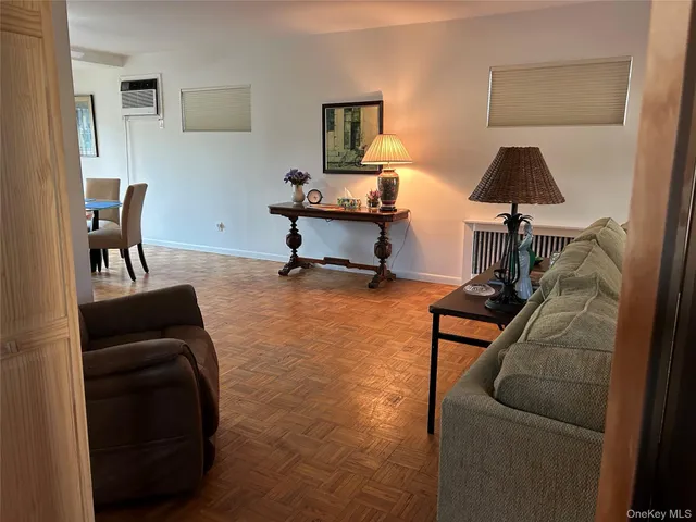 a bedroom with a bed chair and window