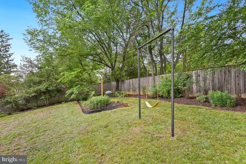 a view of a backyard with swings