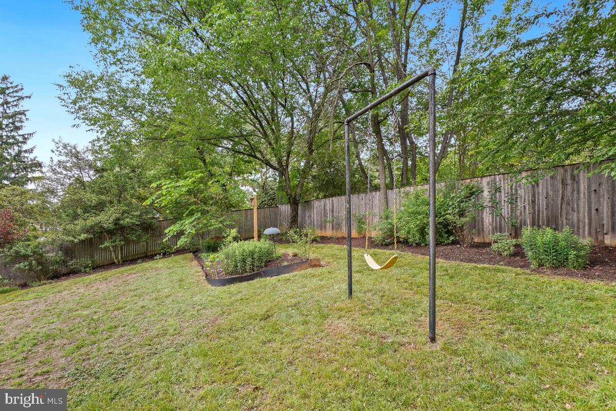 827 Caddington Avenue Silver Spring, MD 20901 - Photo 43 of 45 a view of a backyard with swings