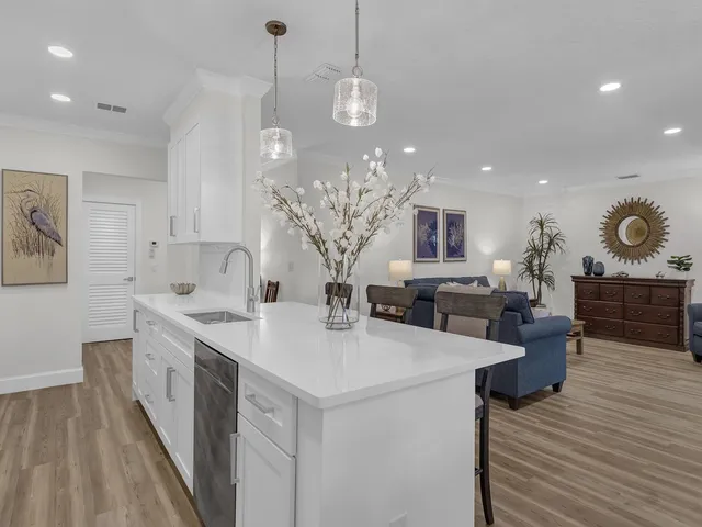 a kitchen with sink and cabinets