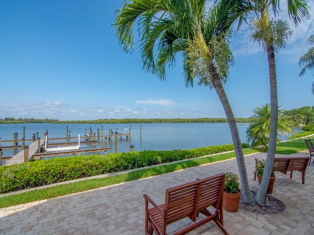 a view of a chairs and table in the garden