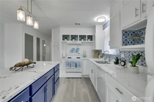 a kitchen with a sink and cabinets