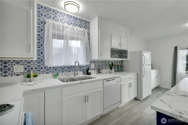a bathroom with a double vanity sink and mirror
