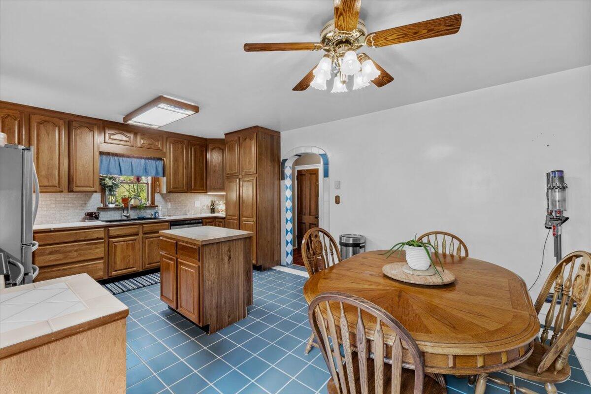 1937 Kunkletown Road Saylorsburg, PA 18353 - Photo 13 of 51 a kitchen with stainless steel appliances granite countertop a sink a stove a dining table and chairs