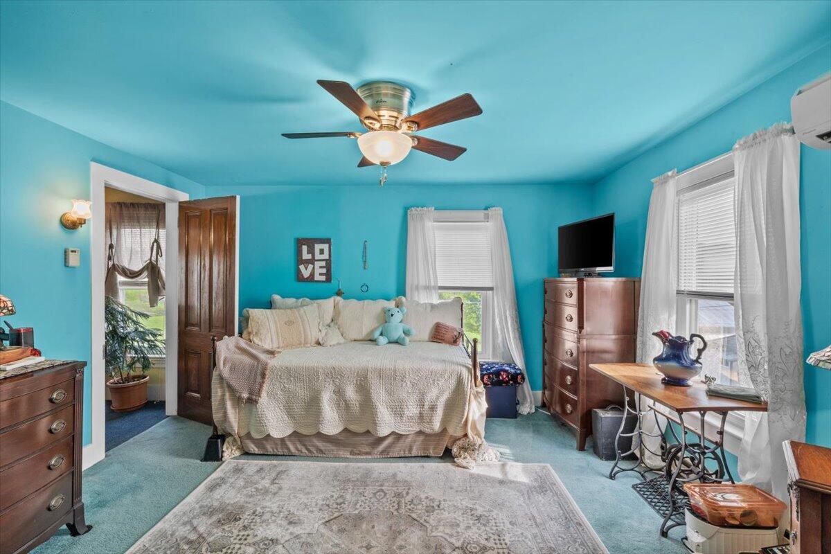 1937 Kunkletown Road Saylorsburg, PA 18353 - Photo 23 of 51 a bedroom with a bed and a chandelier