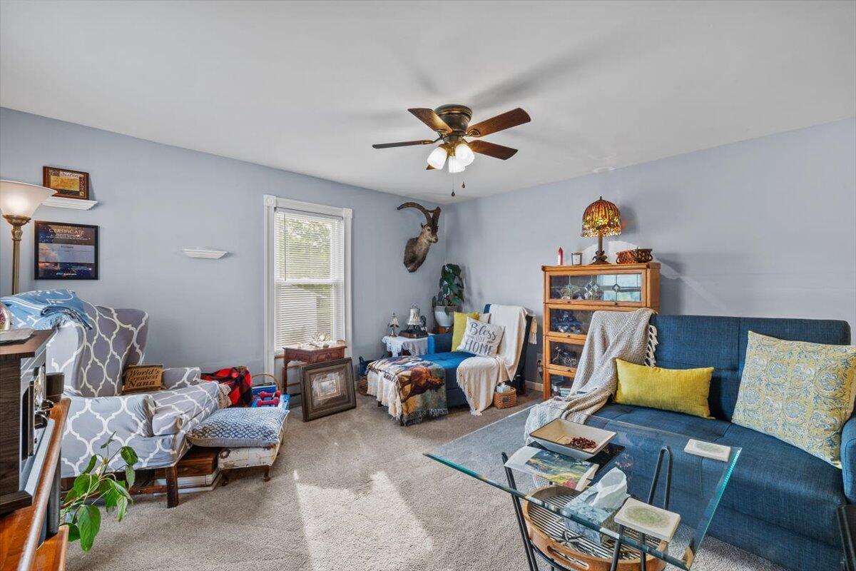1937 Kunkletown Road Saylorsburg, PA 18353 - Photo 29 of 51 a living room with furniture a window and a chandelier