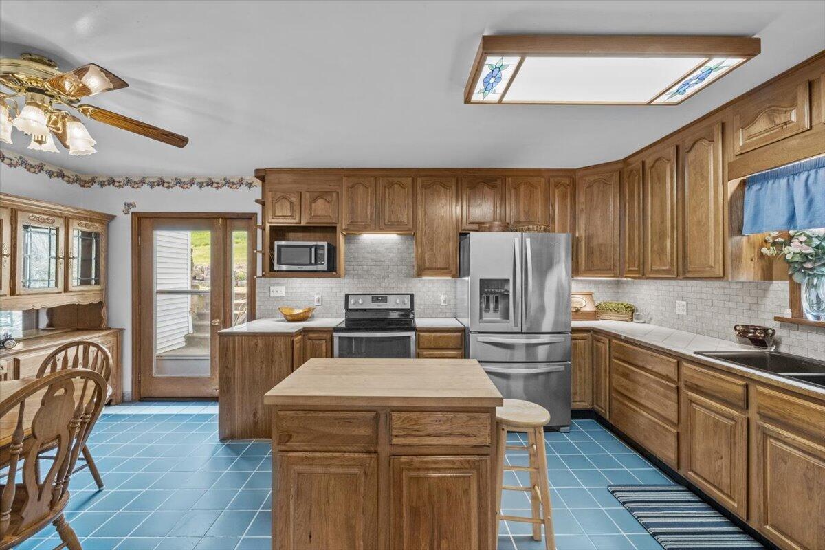 1937 Kunkletown Road Saylorsburg, PA 18353 - Photo 10 of 51 a kitchen with sink cabinets and stainless steel appliances