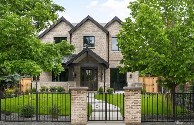 a view of a house with a yard and plants