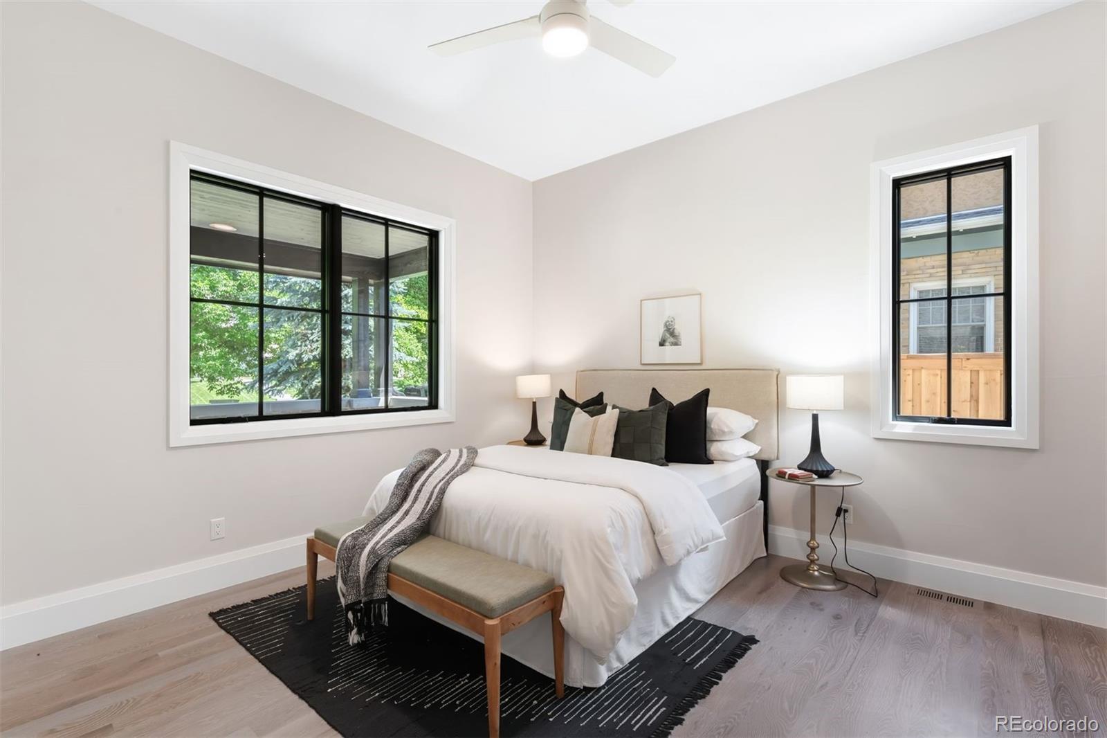 2237 South Madison Street Denver, CO 80210 - Photo 12 of 44 a bedroom with a bed and a window