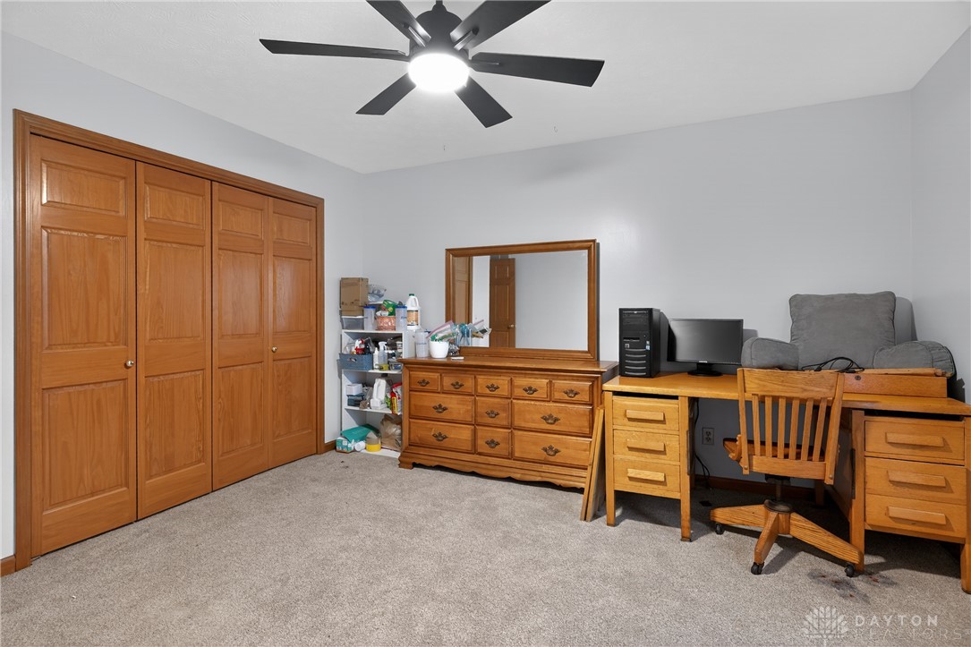 5264 Frazier-Guy Road Sidney, OH 45365 - Photo 28 of 51 This spacious bedroom offers ample storage and comfortable living, with plush carpet underfoot.