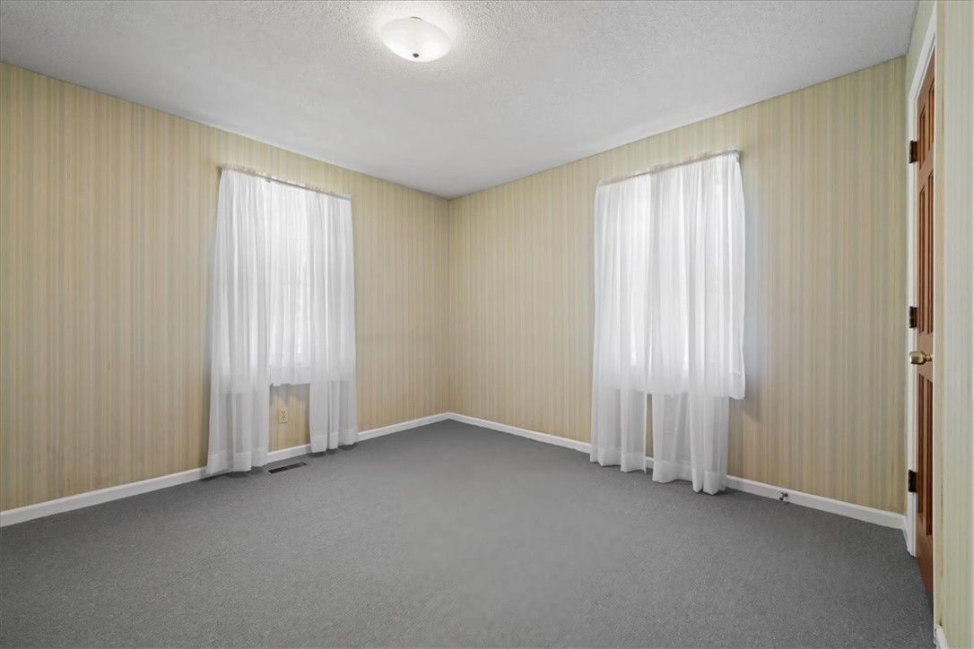 304 Shaw Road Honea Path, SC 29654 - Photo 25 of 39 This spacious bedroom offers ample natural light and a comfortable atmosphere for relaxation.
