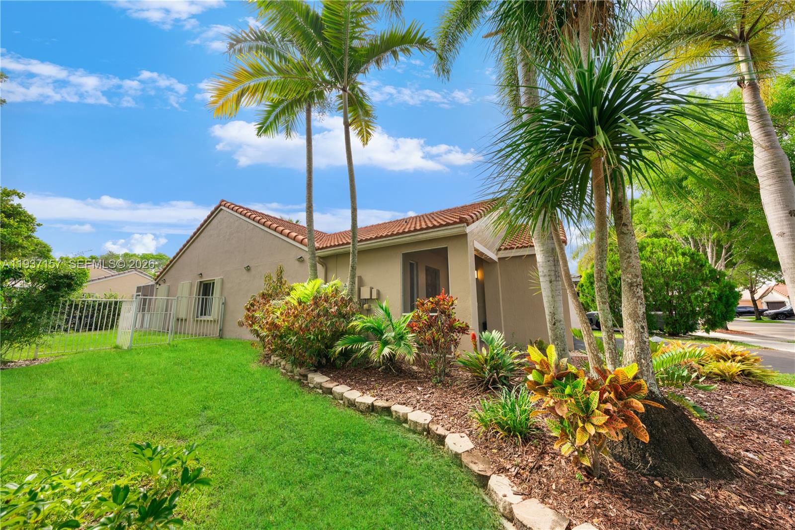 4361 Mahogany Ridge Drive Weston, FL 33331 - Photo 12 of 47 a front view of house with yard and green space
