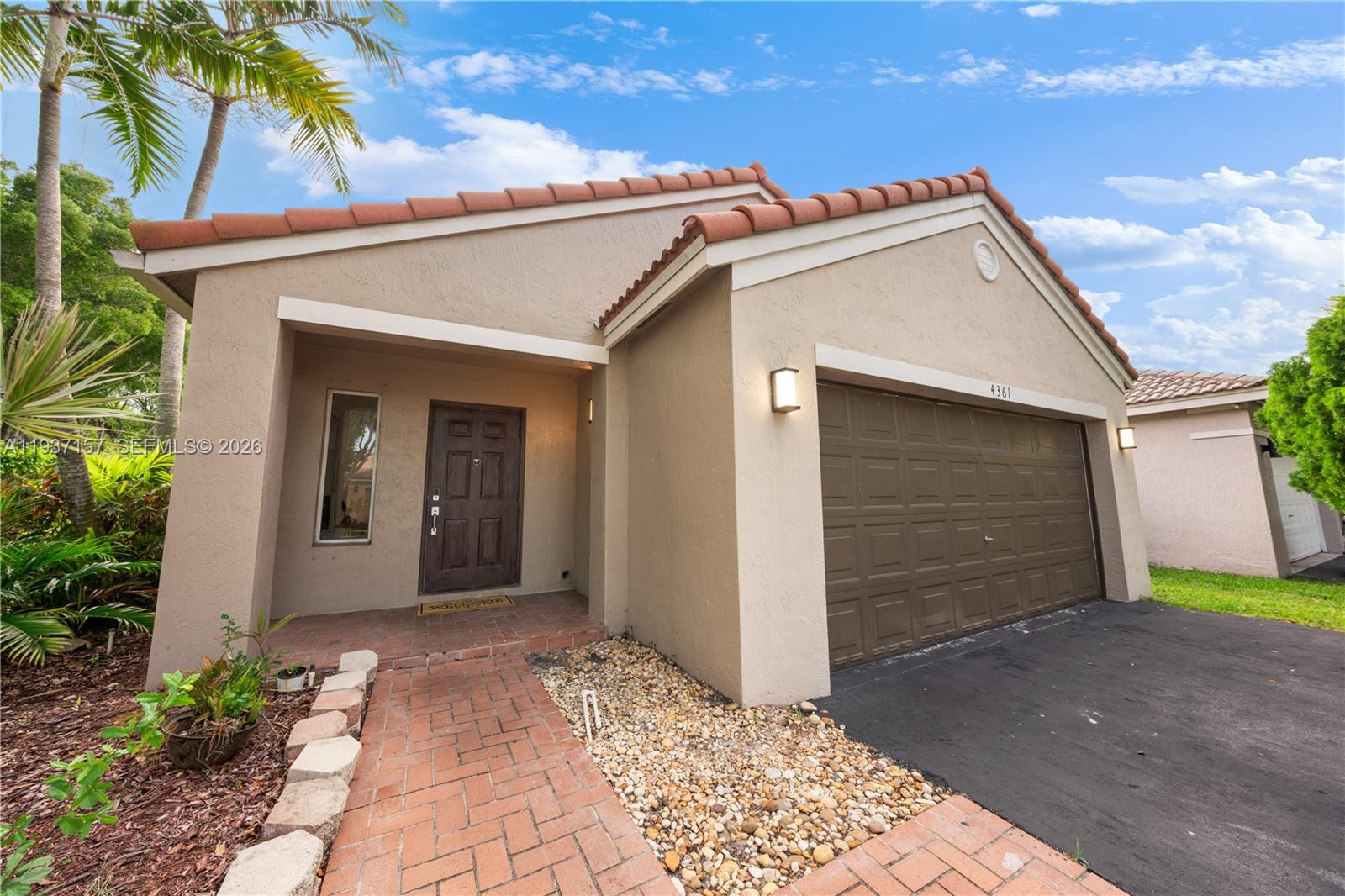 4361 Mahogany Ridge Drive Weston, FL 33331 - Photo 15 of 47 a view of a house with a yard
