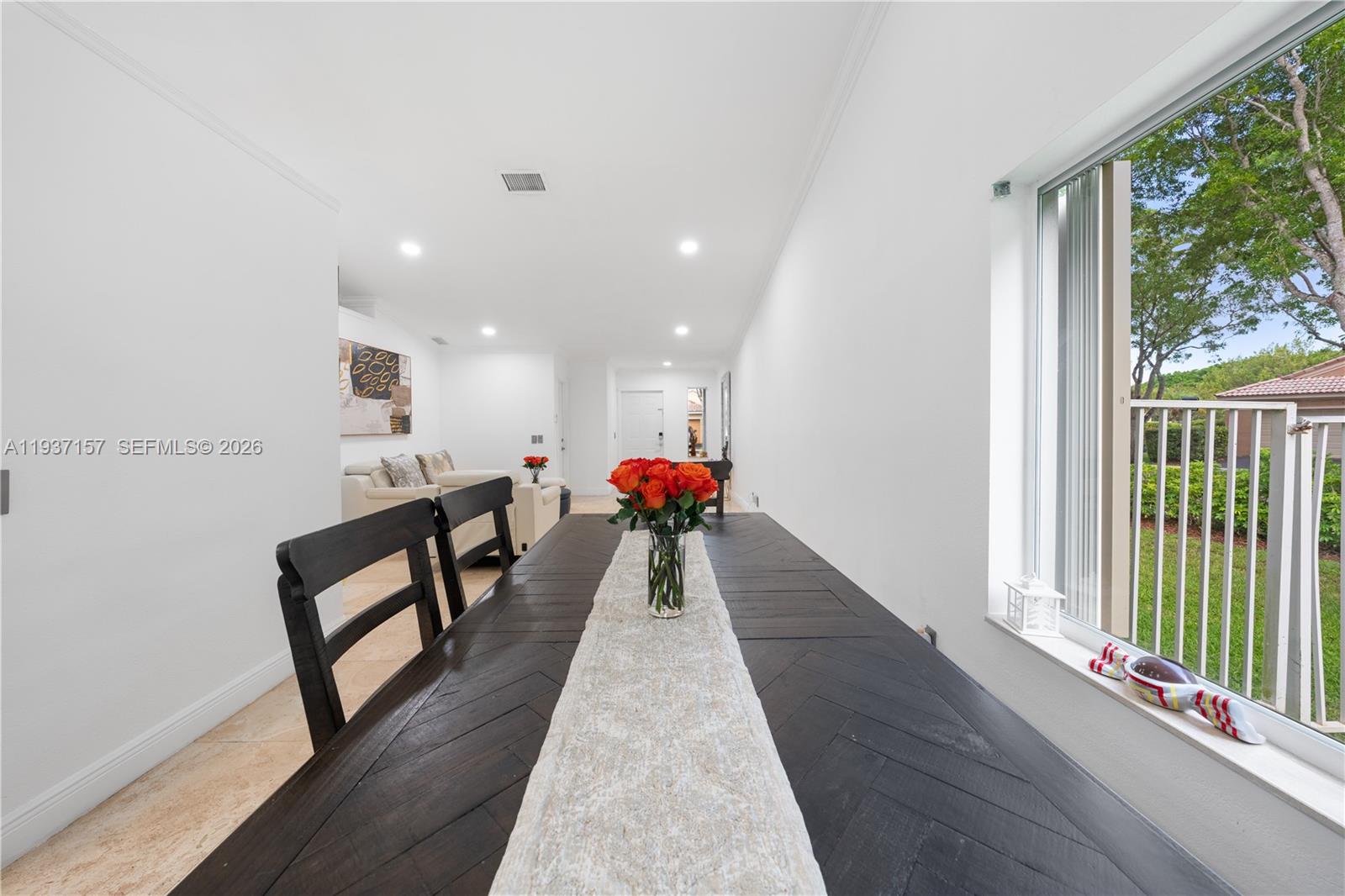 4361 Mahogany Ridge Drive Weston, FL 33331 - Photo 23 of 47 a hallway with furniture wooden floor and a large window