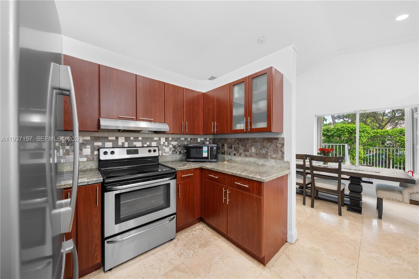 4361 Mahogany Ridge Drive Weston, FL 33331 - Photo 25 of 47 a kitchen with a stove sink and cabinets