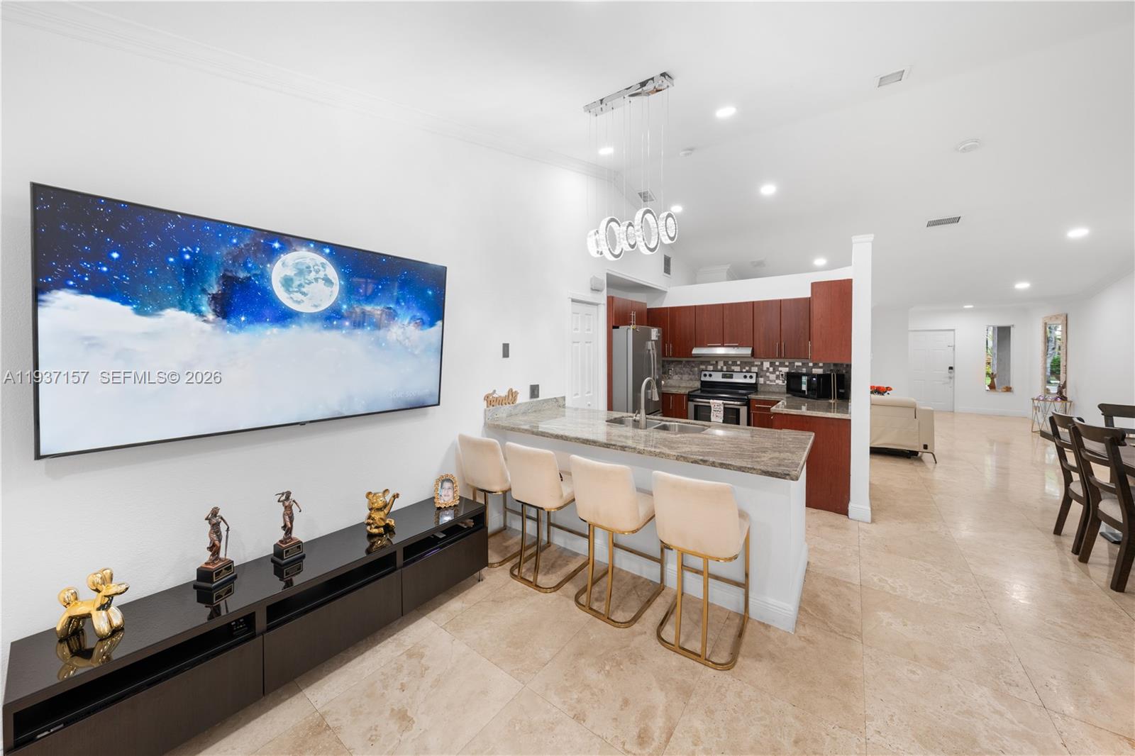 4361 Mahogany Ridge Drive Weston, FL 33331 - Photo 27 of 47 a kitchen with stainless steel appliances granite countertop sink cabinets and wooden floor